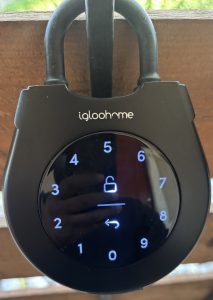 a black padlock with a key on it at The Cedars Apartments